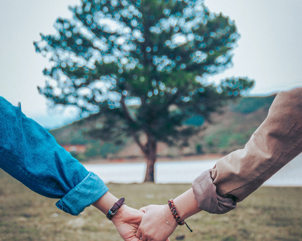 clasped hands frame tree